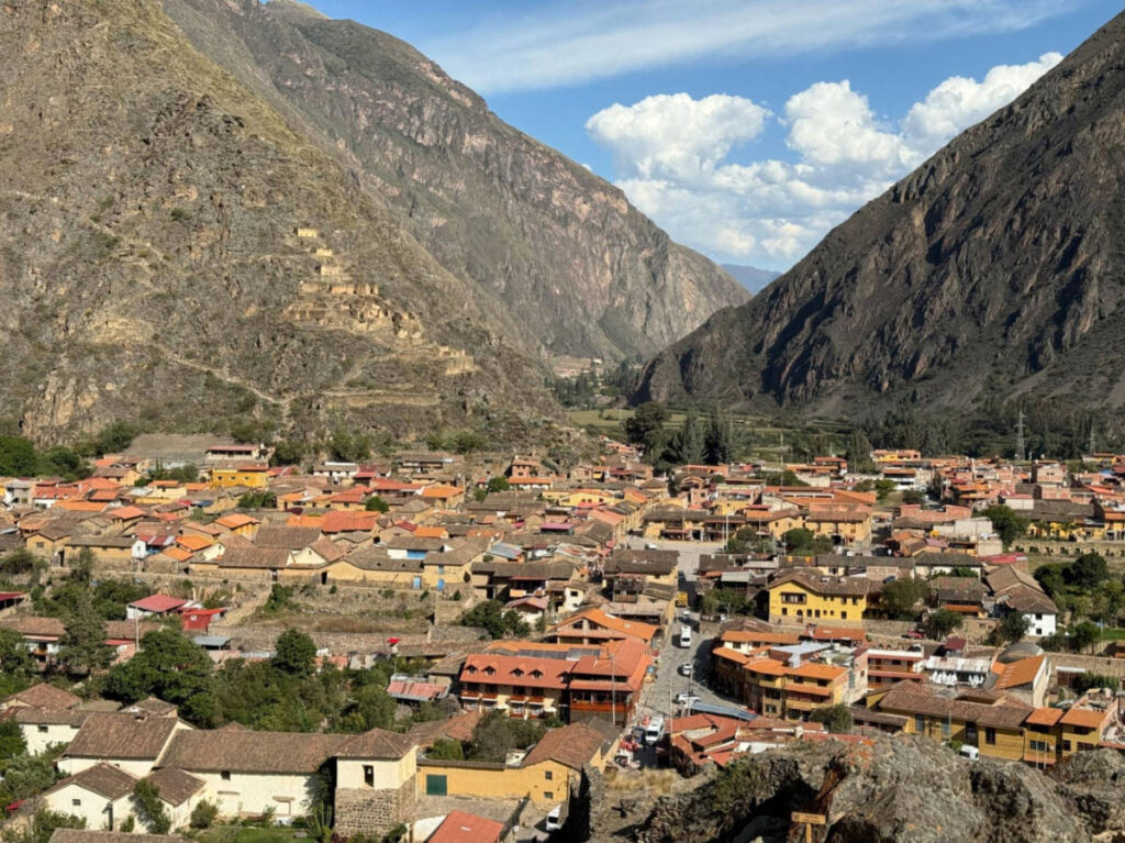 Overlooking view of the colorful houses in front of the hills in the Town of Ollantaytambo