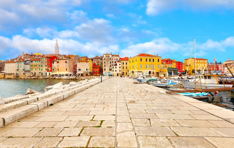 A promenade leading to the colorful town