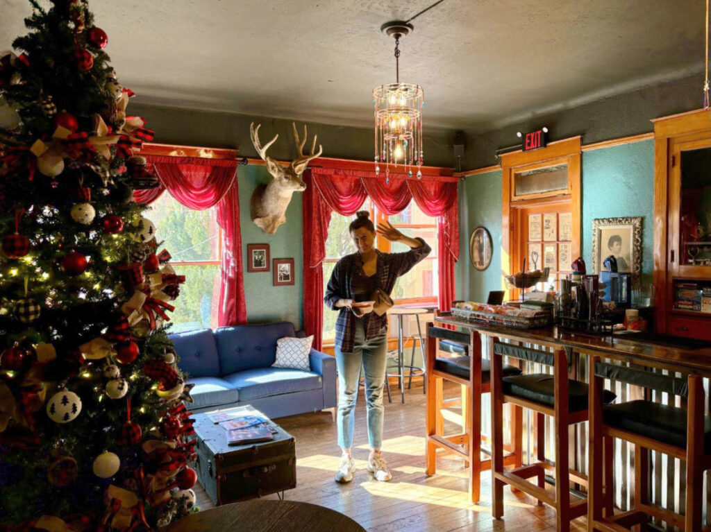 A woman standing at the common area at the Oliver House