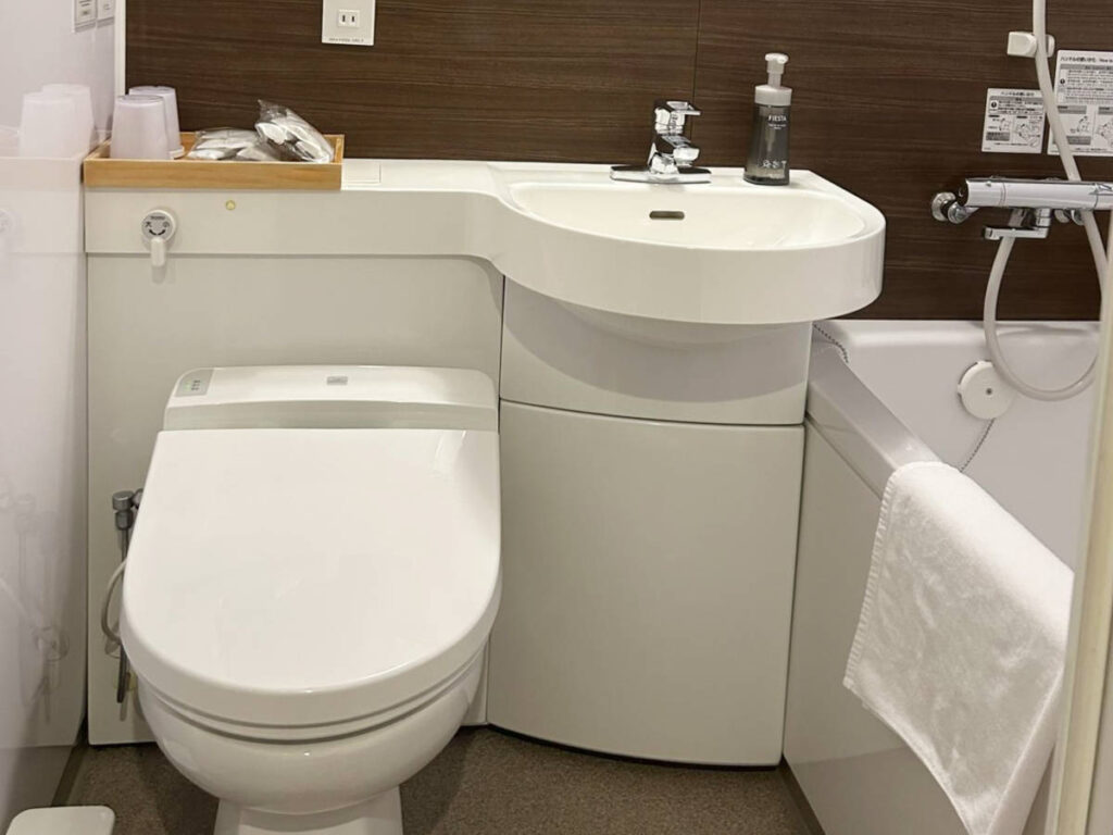 View of the compact and clean hotel bathroom