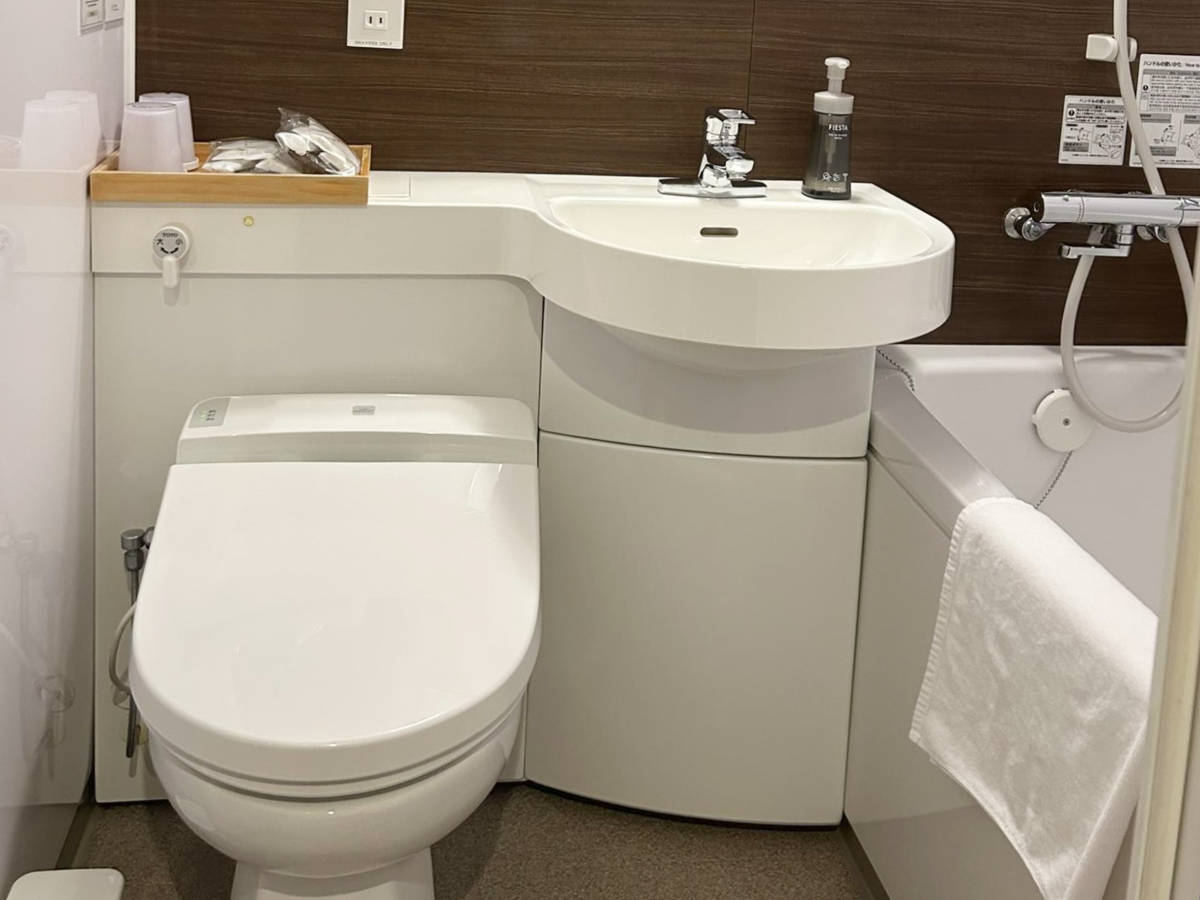 View of the compact and clean hotel bathroom