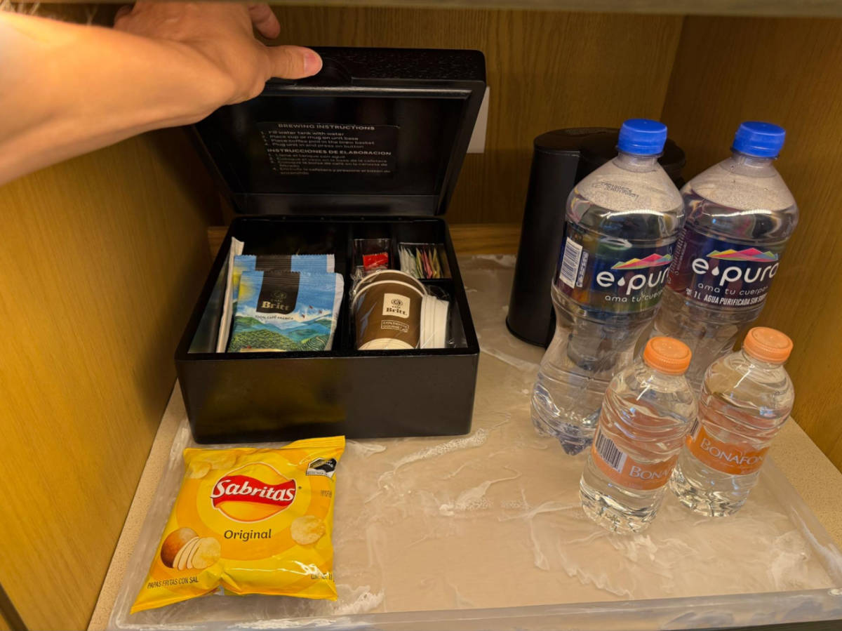 View of the complimentary snack, tea, and water bottles