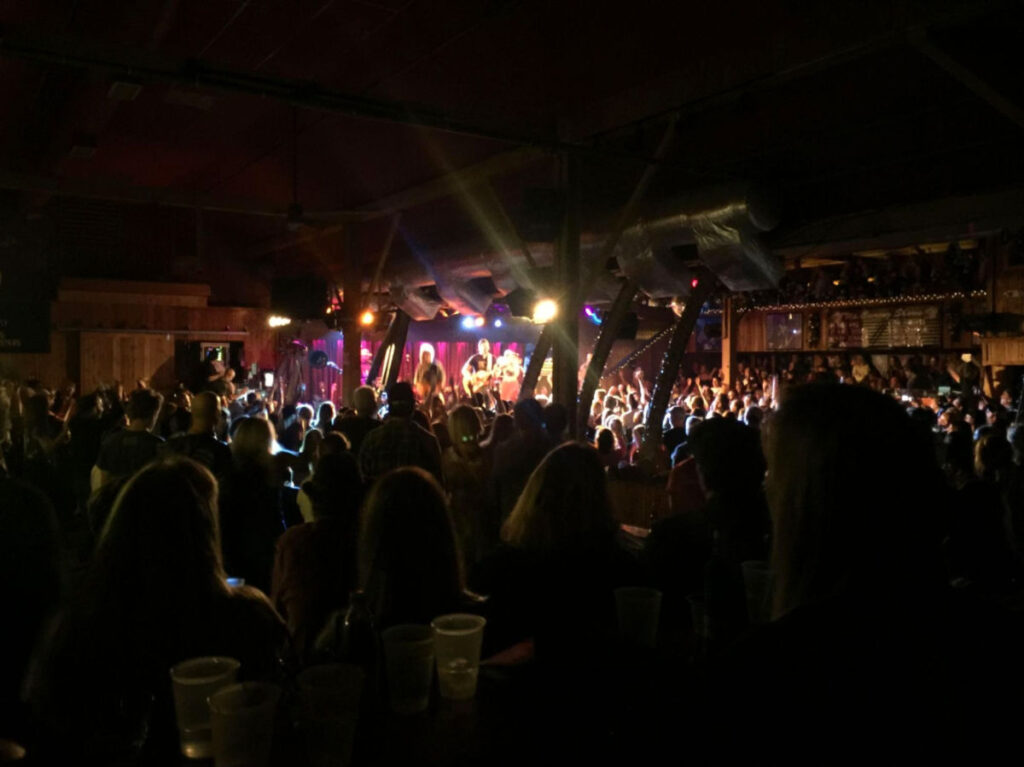 Crowd of people enjoying a Michael Franti concert at Belly Up Tavern