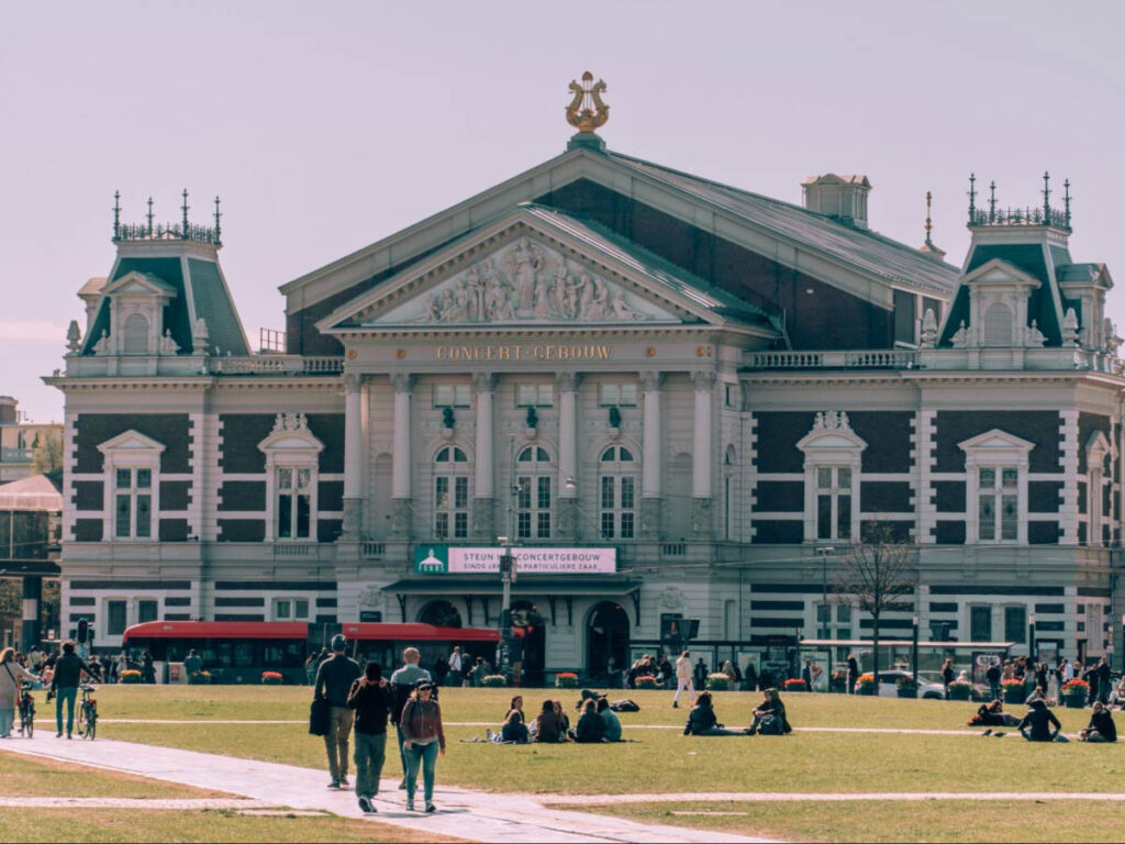 View outside Concertgebouw with people walking and relaxing