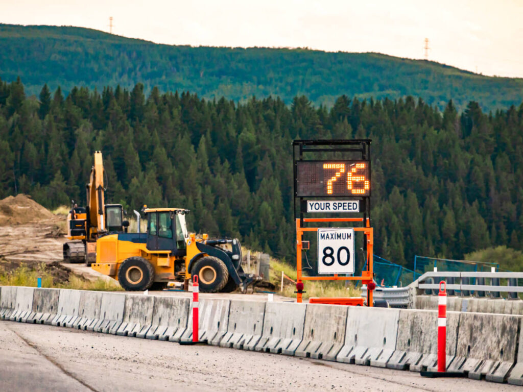 View of the construction zone and speed limit detector along the road in Canada