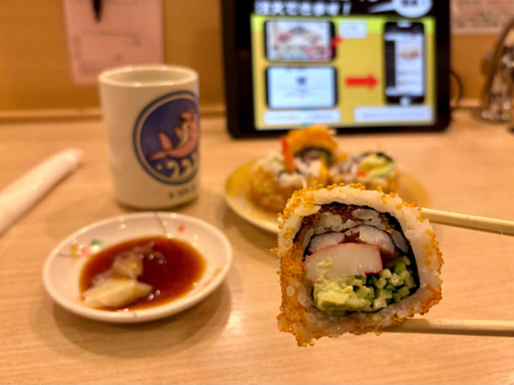 A close up look of a sushi on a conveyor belt sushi