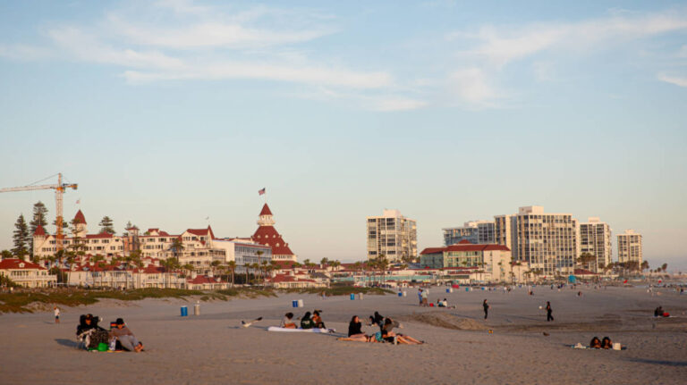 People enjoying their day at the Coronado Beach