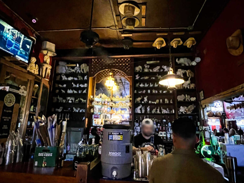 Man ordering at the counter of The White Elephant