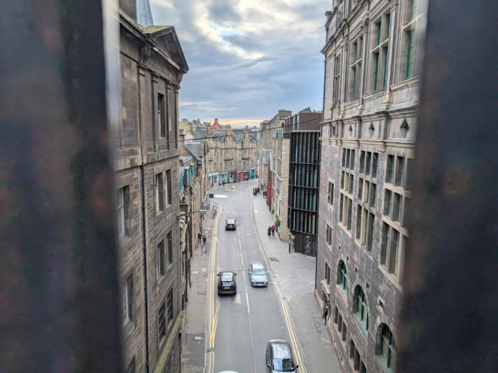 View of cars passing by Cowgate