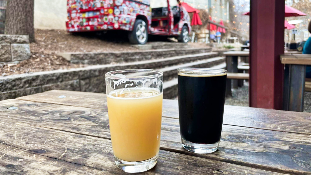 Two glasses of different craft beers from Burial Beer Co in Asheville