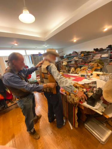 A man creating a custom-built jacket inside the store