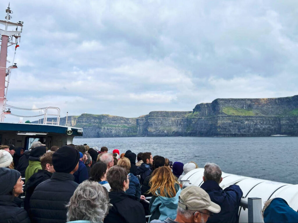 The crowd admiring the Cliffs of Moher from the ferry