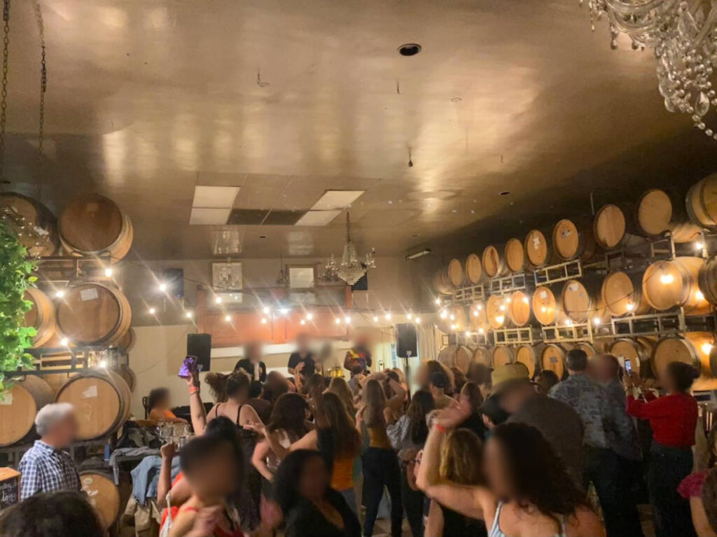 View of the crowd enjoying the salsa night at Witch Creek Winery