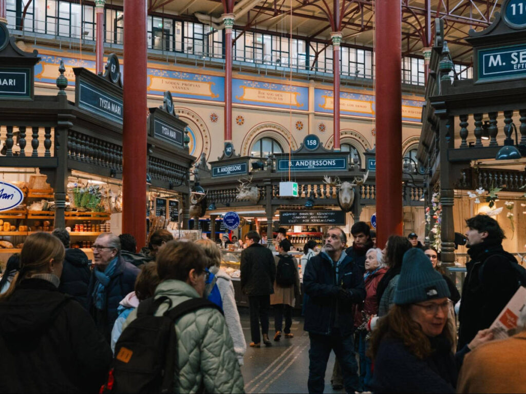 The crowd wandering around the Östermalmshallen
