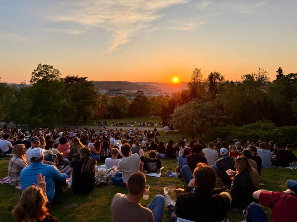 The crowd watching the scenic sunset view in Riegrovy Sady
