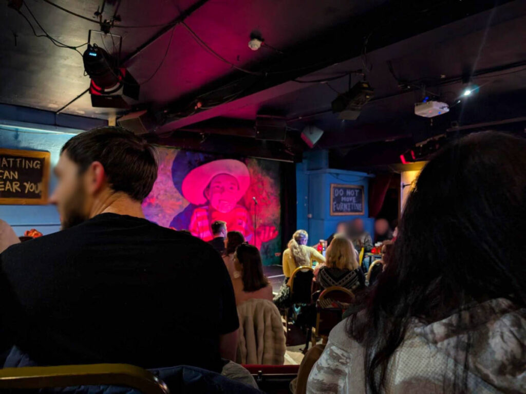 The crowd enjoying inside The Stand Comedy Club