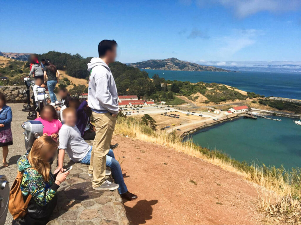 The people enjoying the overlooking view of the California bay from the Vista Point