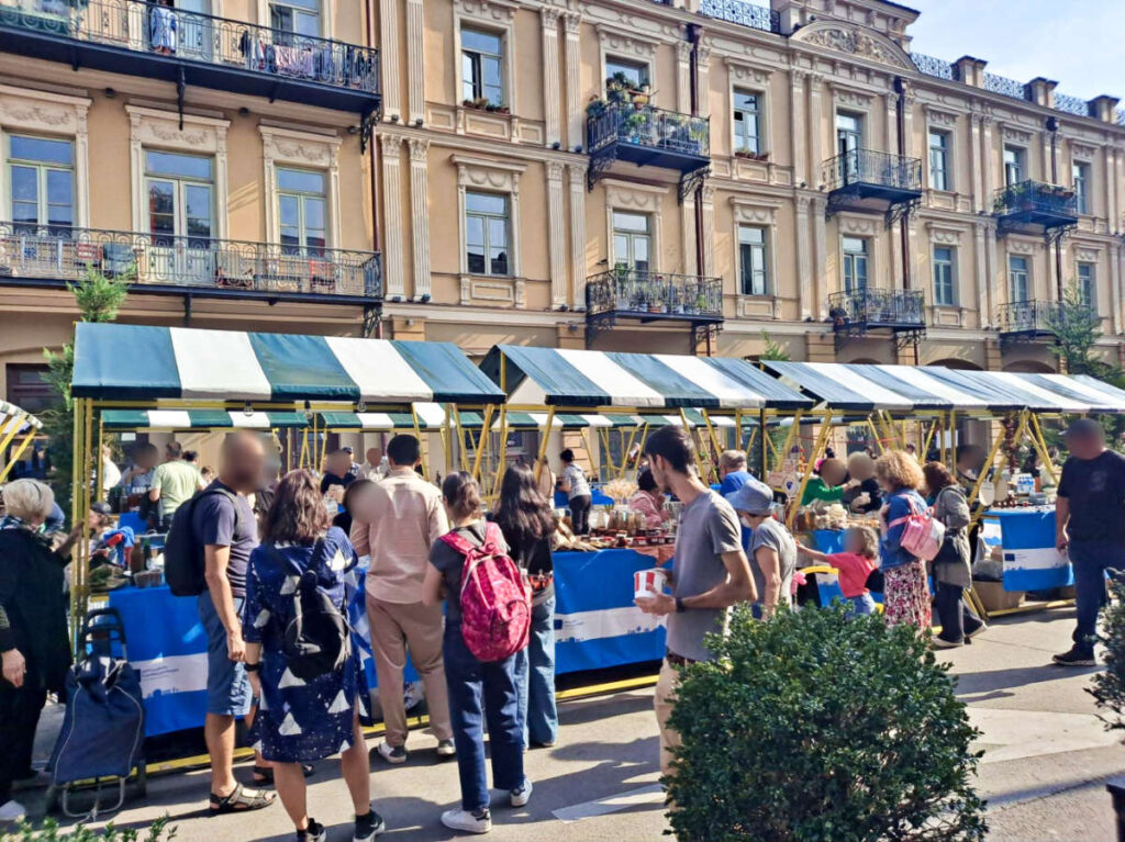 The crowd wandering around the market in Georgia during summer season