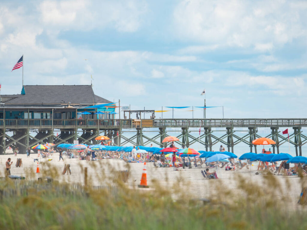 View of the boardwalk and the crowd at the beach
