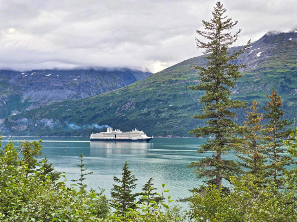 A cruise ship sailing along the scenic mountain views near Whittier