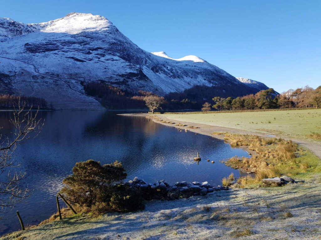 Scenic view of the snowy peaks at Crummock Water