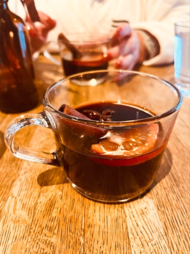 Two glasses of Mulled Wines on a wooden table in Thermea Spa