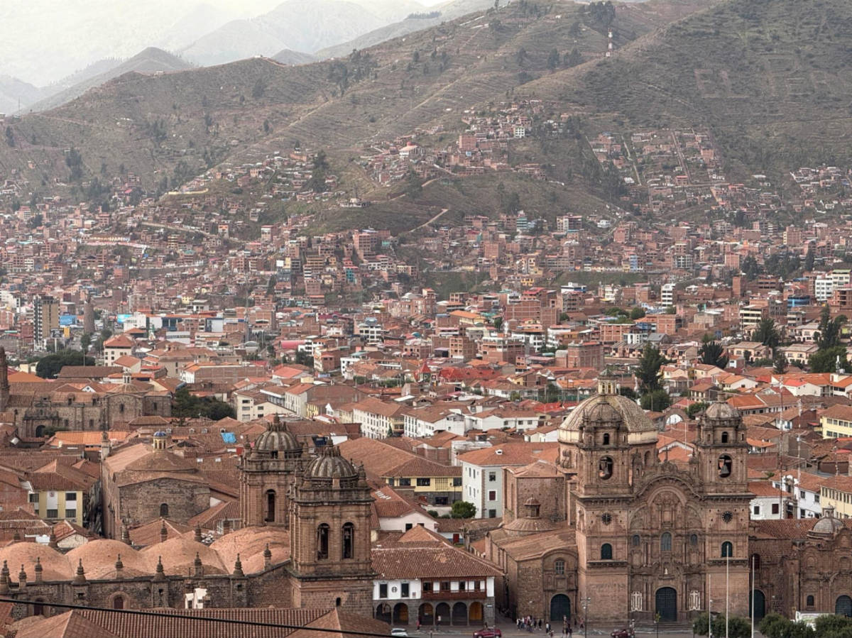Aerial view of the historic buildings and the the hills in the Historic Center of Cusco