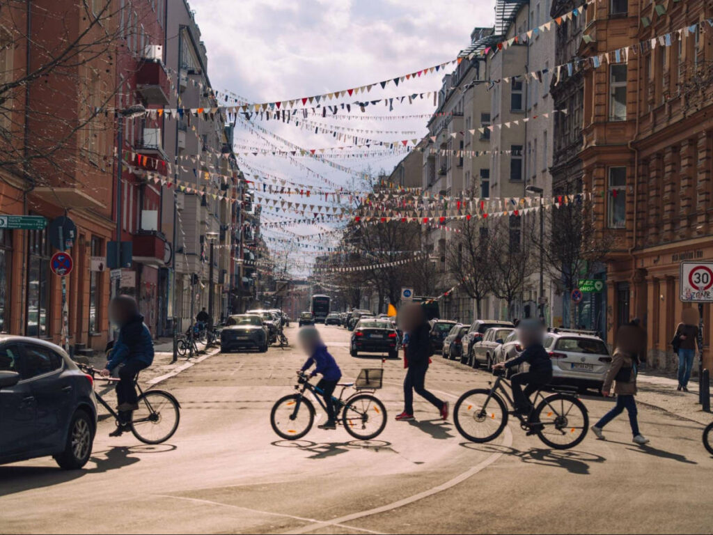 View of the locals riding bicycle while crossing the street