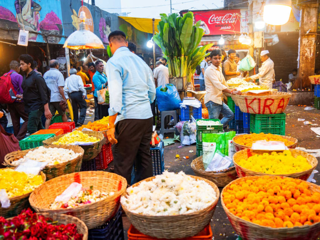 A vendor of fresh flowers at the Dadar Flower Market