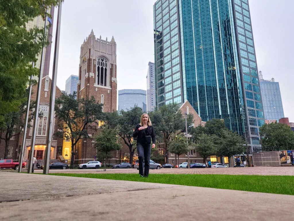 Exterior view of Dallas Museum of Art with modern architecture and author Sarah Heath in the front