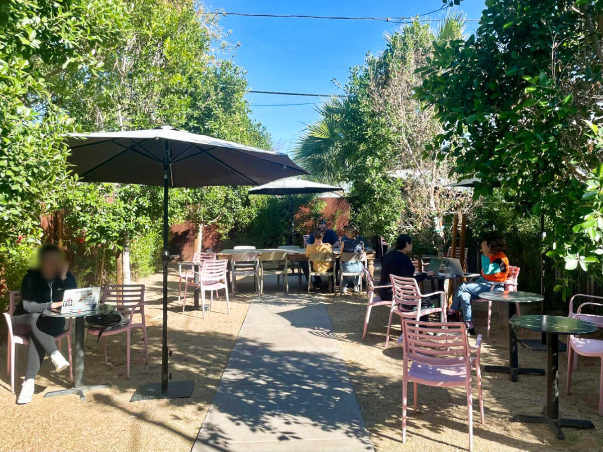 People at the outdoor seating area of Dark Hall Coffee