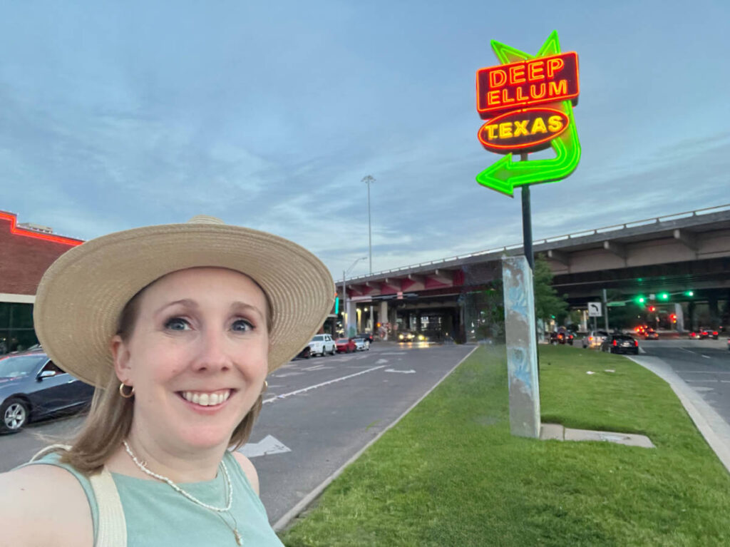 The author, Sarah Heath smiling for a selfie at the Deep Ellum - Dallas Neighborhood
