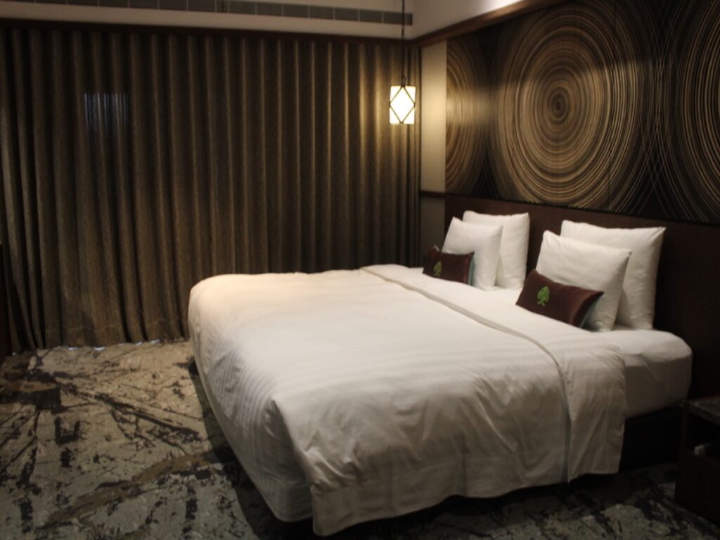 View of the Deluxe Double Room with curtain closed