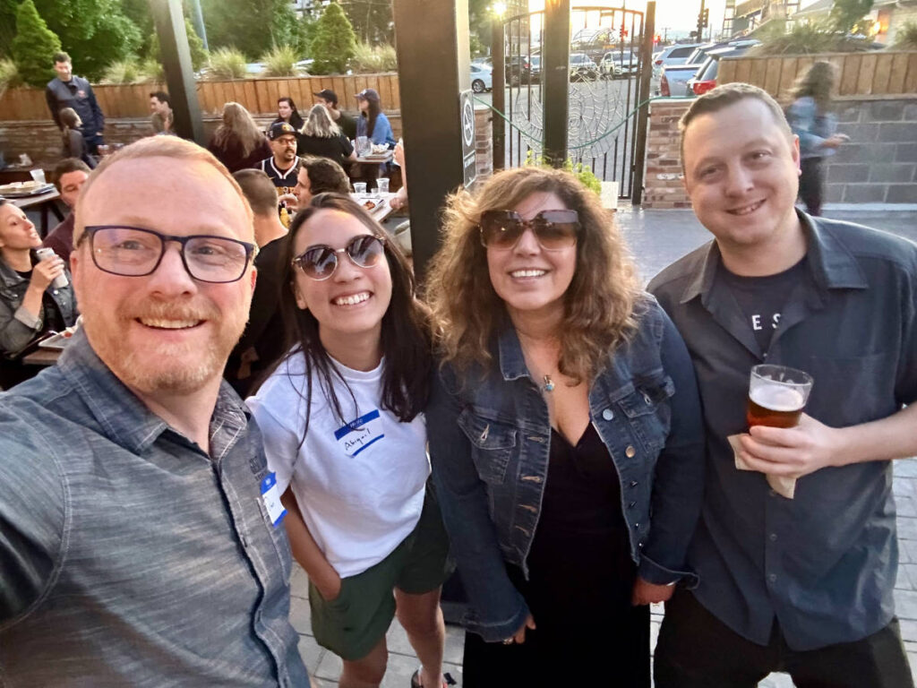 People smiling for a photo during the Travel Lemming's Denver Meetups