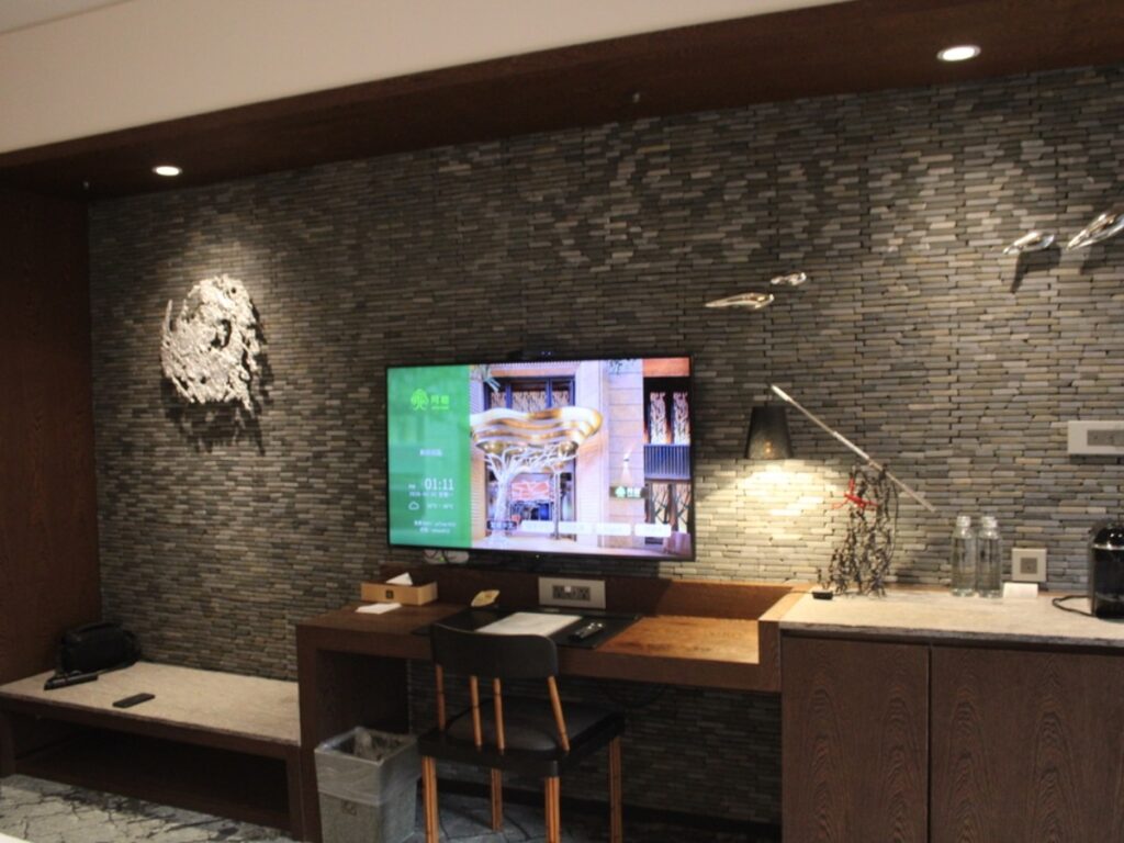 The desk area and tv in the Deluxe Double Room