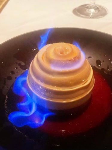 A dessert with flame served at Gary Danko