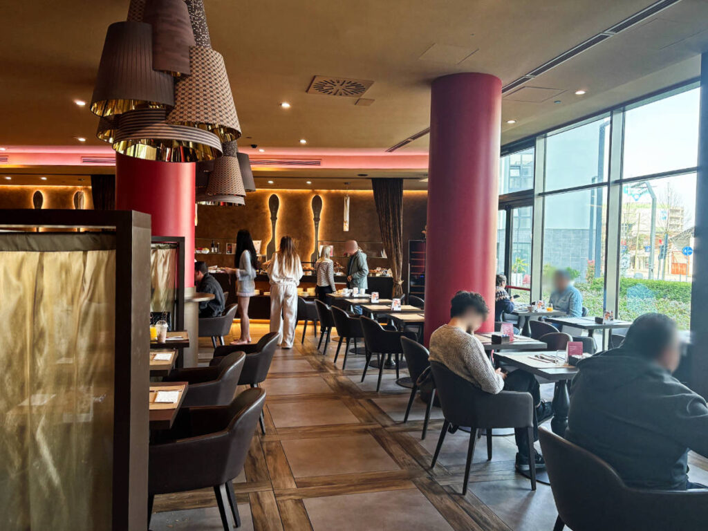People at the dining area in Leonardo Royal Hotel Mestre