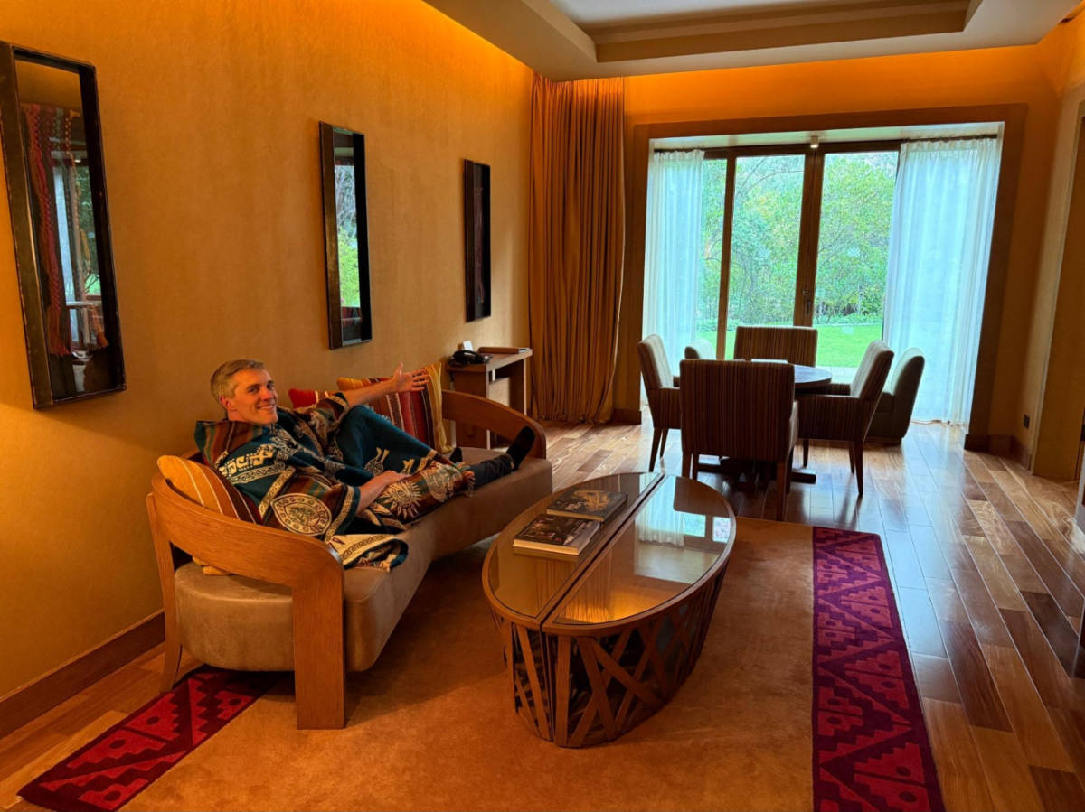 Me showing off our massive living/dining room area (it was a bit dim when we took this photo around sunset)