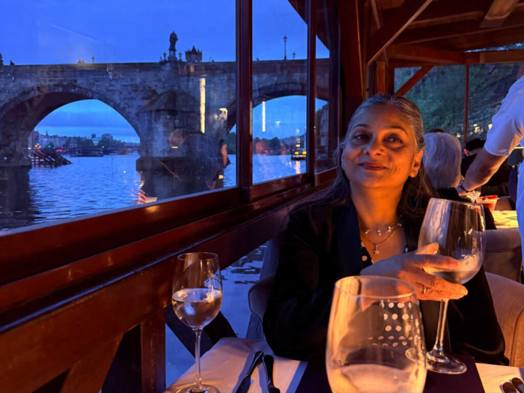 The author's mother holding an empty glass of wine at Kampa Park