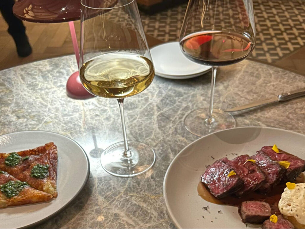 The dishes and glasses of wine at Tavernetta at the Ritz-Carlton Vail