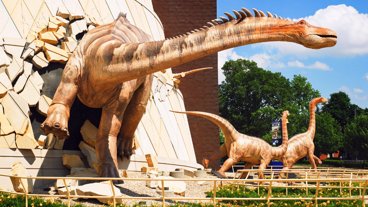 View of the dinosaur sculptures outside The Children's Museum of Indianapolis