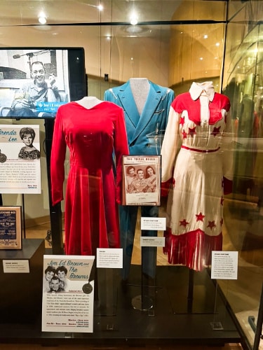 View of the displayed costumes inside the Country Music Hall of Fame