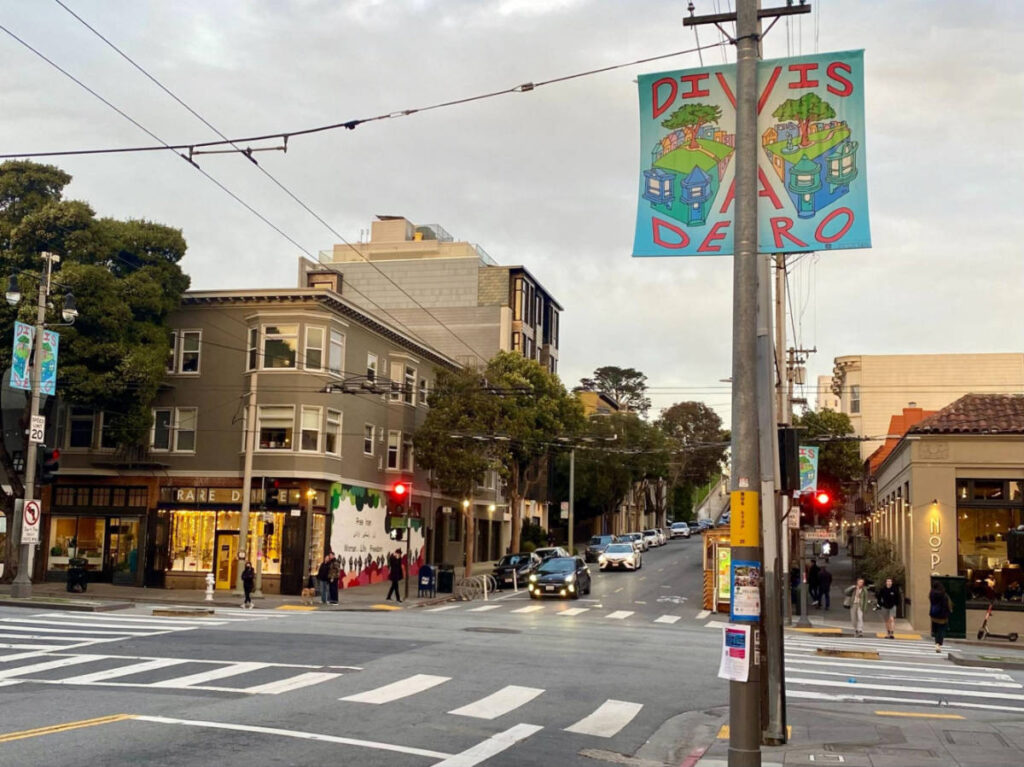 View of the shops and restaurants around the Divisadero street at sunset