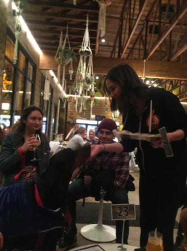 Dog being taken cared of by the server at Modern Times Far West Lounge