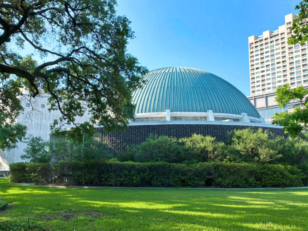 View of the dome of the Burke Baker Planetarium and the greenery around