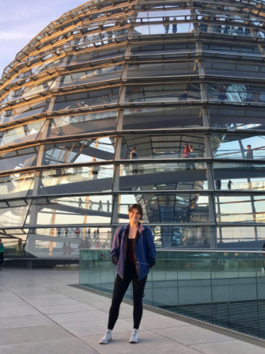 Travel Lemming writer Betty standing in front of the glass dome of the Reichstag building