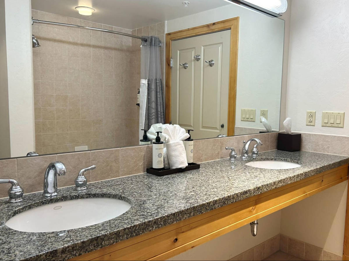 View of the huge mirror and the double sink at The Steamboat Grand
