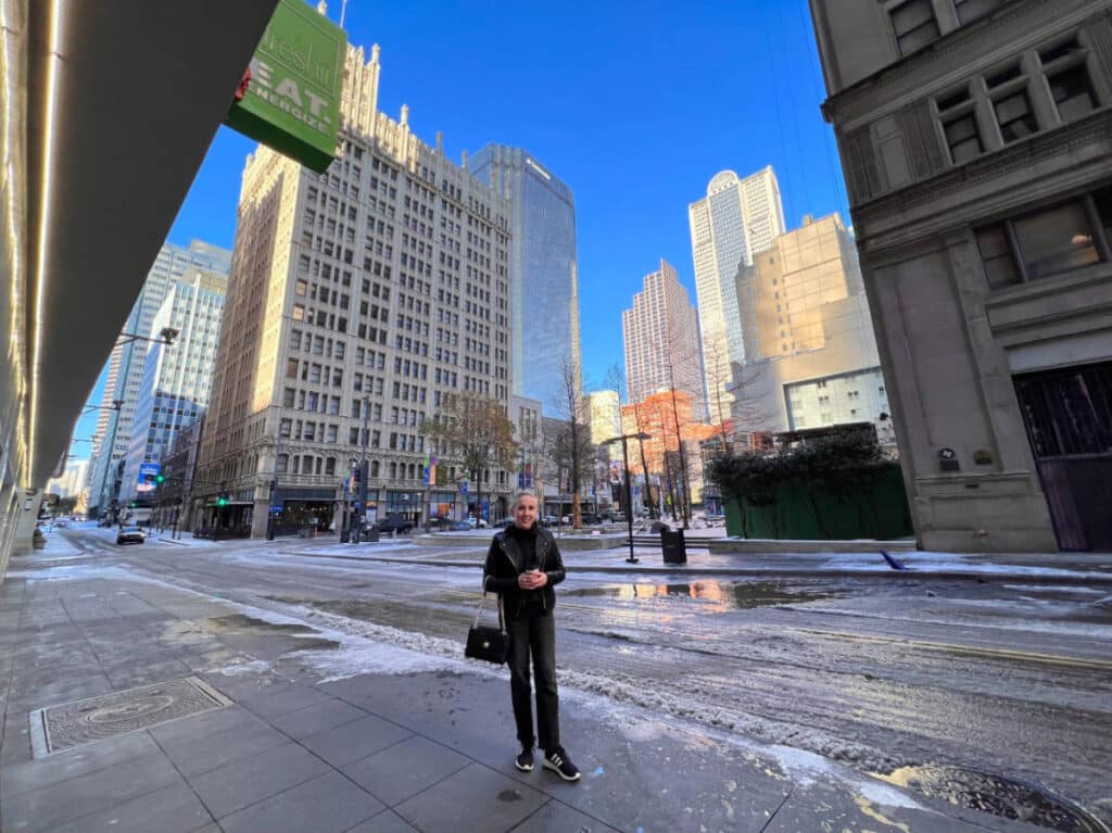 The author, Sarah Heath smiling for a photo at Downtown Dallas Historic District