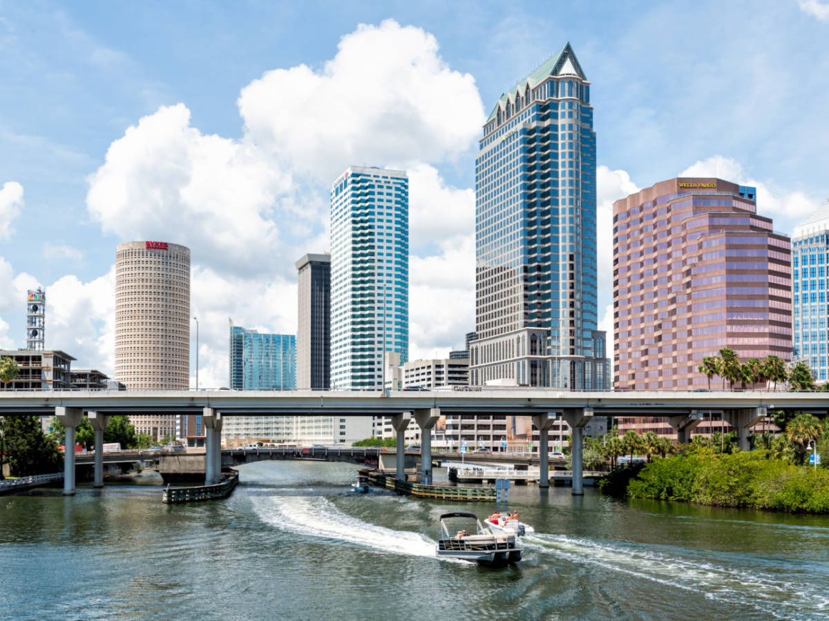 Downtown city in Florida with bridges, highway, boat yacht, skyscrapers office modern buildings