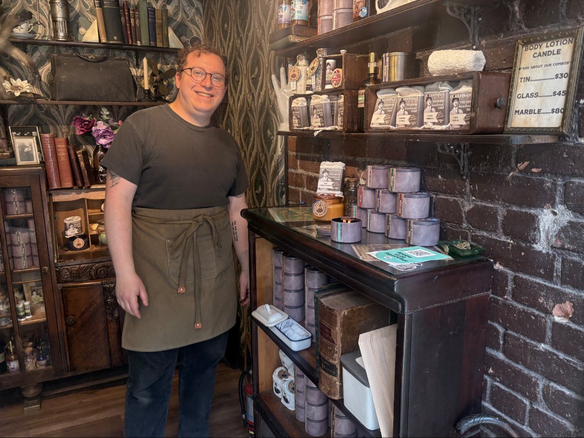 The owner of Dr. Silkman’s Tiny Store posing for a photo